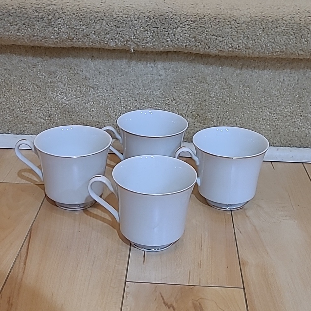 4 Tiffany fine china white with gold rim cups